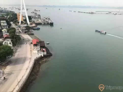 a body of water with boats and buildings along it