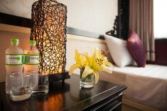 a vase with yellow flowers on a table