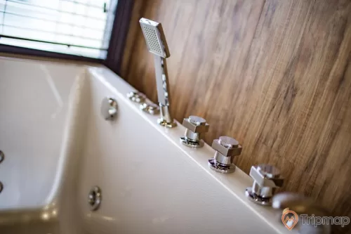 a bathtub with a faucet and a faucet