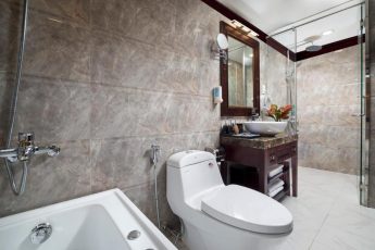 a bathroom with a tub toilet and sink