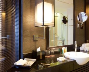 a bathroom with a sink and mirror