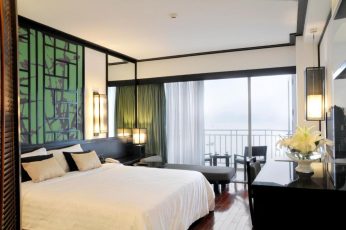 a room with a bed and a window
