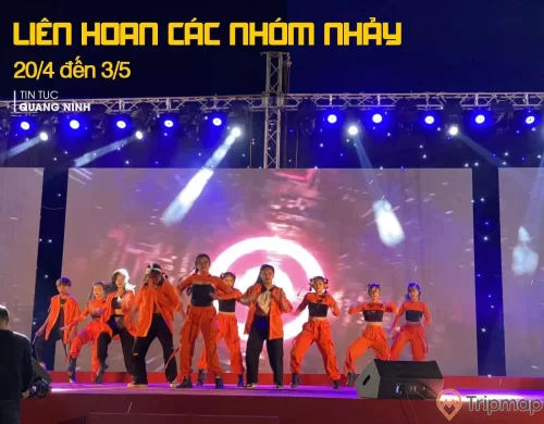 a group of people in orange uniforms on a stage