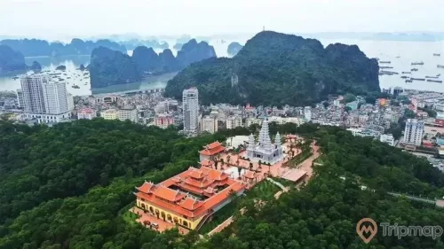 a city with a body of water in the background