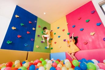 a child playing in a playroom