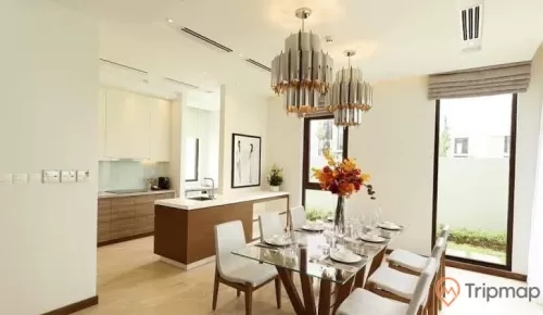 a dining room with a chandelier and a table