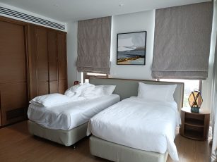 a couple of beds in a room