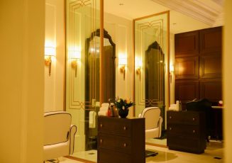 a room with a mirror and a dresser