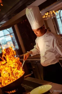 a chef cooking food in a restaurant