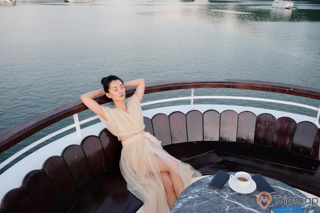 a person in a white dress on a boat