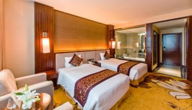 a hotel room with two beds